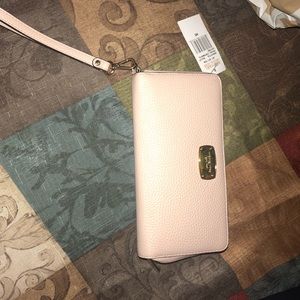 Michael Kors travel wallet in ballet pink